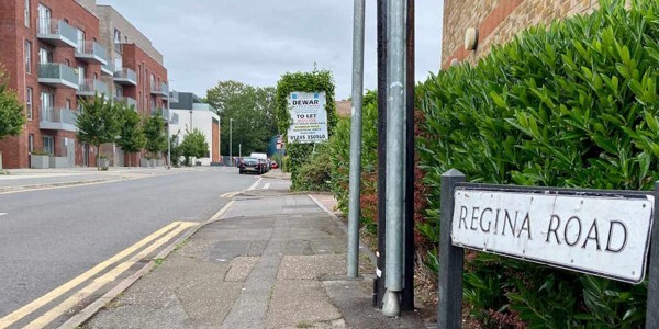 View down Regina Road in Chelmsford with street sign in foreground