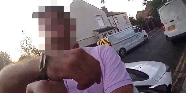 Body worn video image of man being arrested near to the road