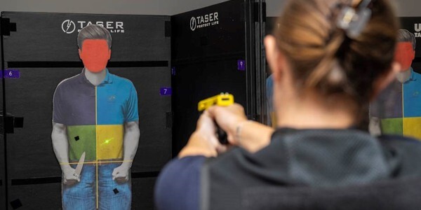 An Essex Police officer uses the T10 device in training
