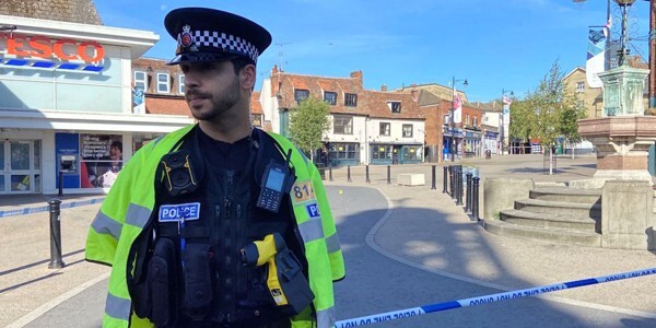 Police officer guarding the scene in Market Square Braintree