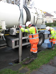 Highways crew clearing a blocked gully