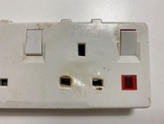 Close-up of damaged extension lead
