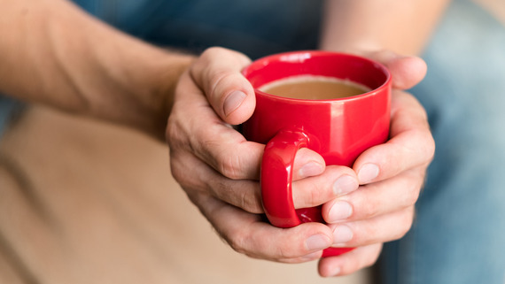 Hands around warm mug
