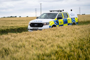 Police car in field 