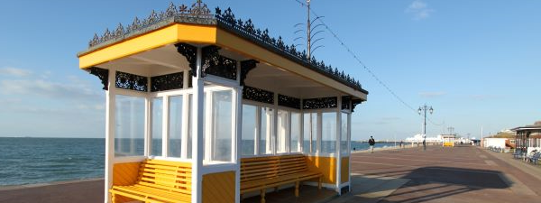 yellow shelter by seafront