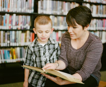 Adult reading to child