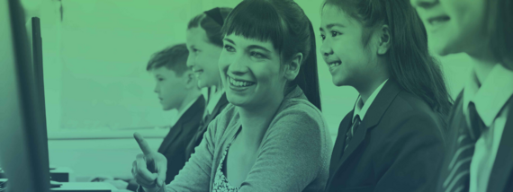 teaching assistant with children in classroom