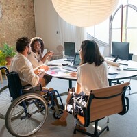 Disability confident employer office desk discussions