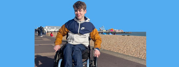 boy in wheelchair at beach