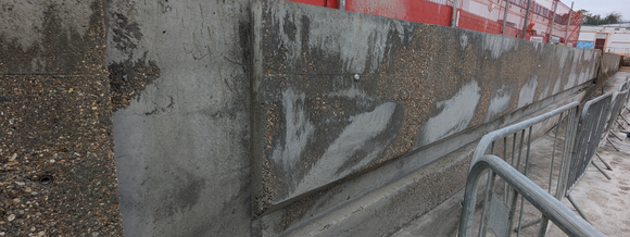 Wall section with recess for ladder and foot rest