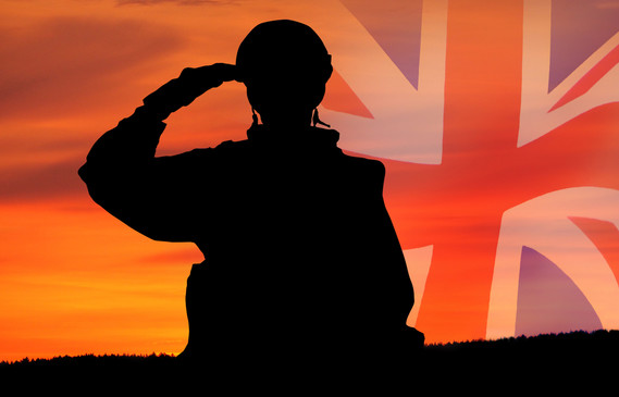 Black silhouette of soldier saluting a Union Jack flag