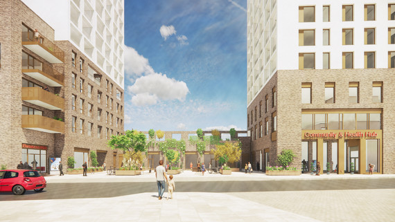 Man and child walking across square