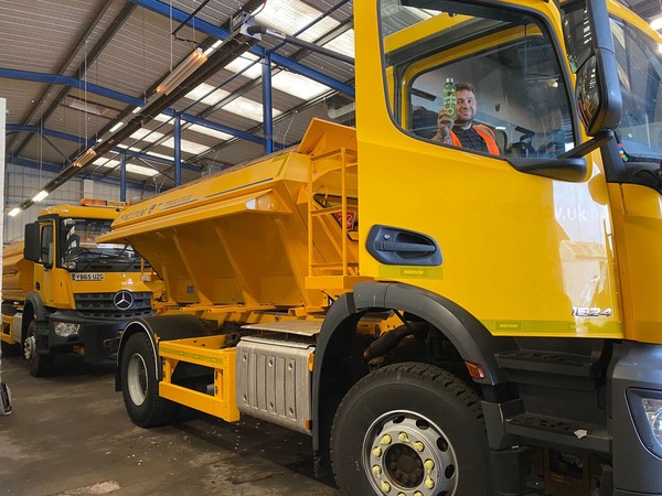 Image of man sitting in a gritter