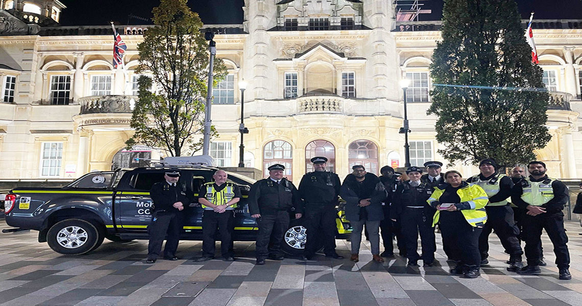 Police and council officers standing outside Town Hall