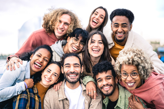 Multi ethnic guys and girls taking selfie outdoors 