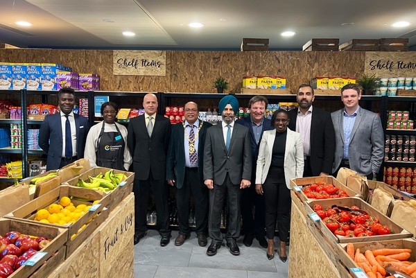 Councillors and grocery staff pictured inside store