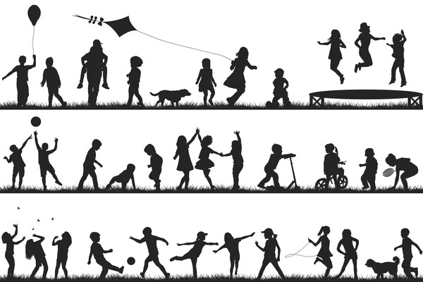 Children silhouettes playing outdoo
