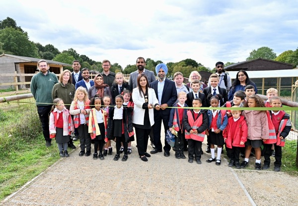 People cutting a ribbon