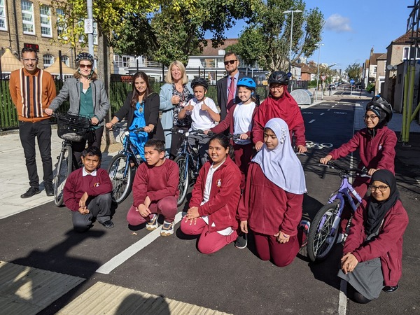 Pupils and Cllrs lined up on bikes