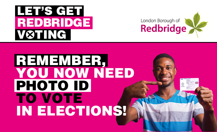 Young man holding up driving license