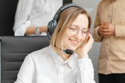 a woman on the phone wearing a headset