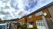 Residential building with shrubbery in front