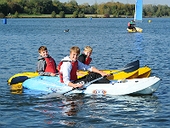 Three boys canoeing at Rother Valley Country Park
