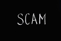Black and white image with the word scam 
