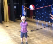 badminton net set up on theater stage