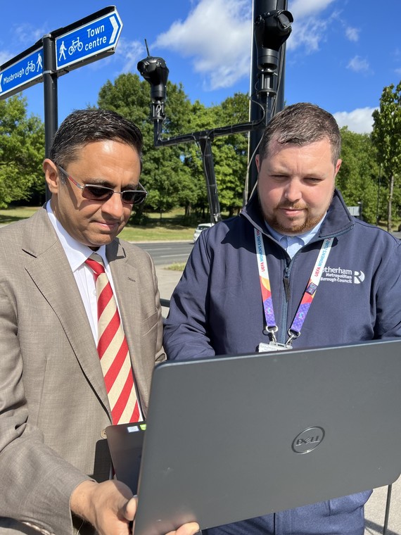 Councillor Alam reviewing new software and equipment.