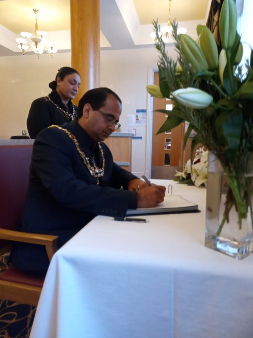Mayor signing book of condolence