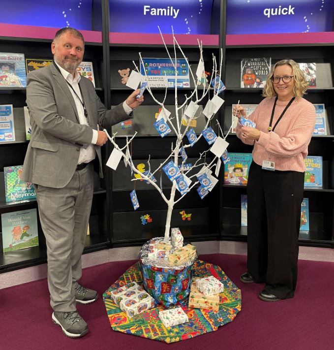 Council representatives with presents an tree