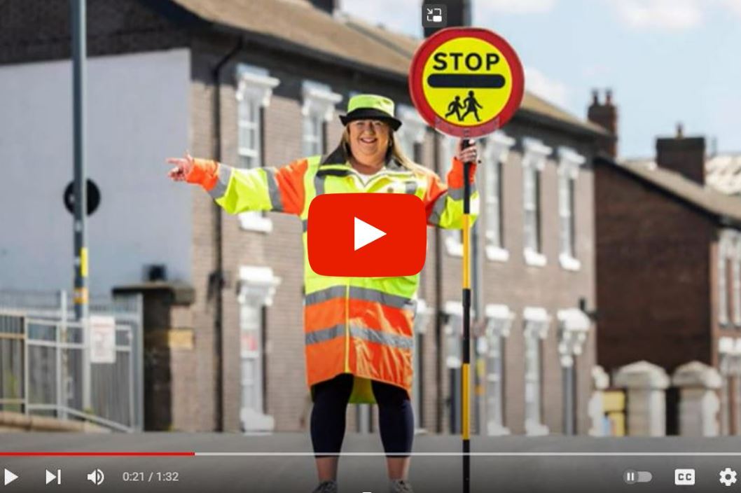 Sandy Cox with warning lollipop sign