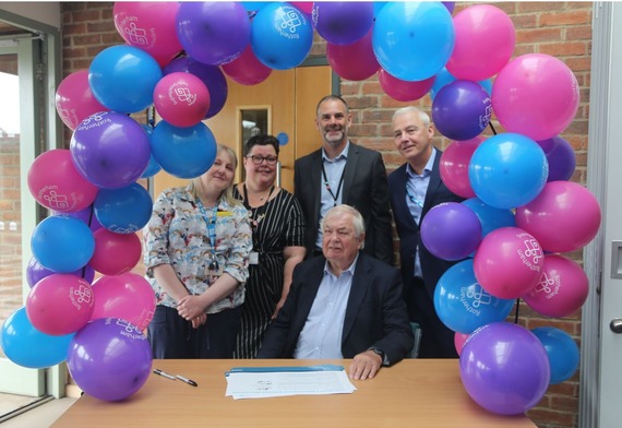 People from the breast feeding partner agencies pose for group photo.