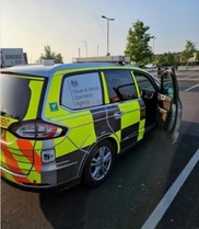 Marked Driver and Vehicle Standards Agency car in carpark