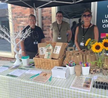 People stood behind a stall