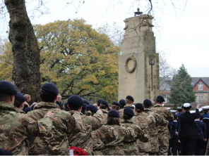 Soldiers marching past cenotaph