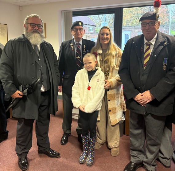 Photograph of Councillors with residents at a service. 