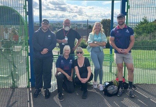 Photograph shows players from the rugby club with Councillors 