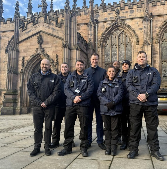 Small group of people stood in front of Rotherham Minster