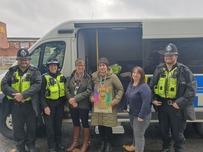Domestic abuse team and police talking with residents about support and services that are available to victims of domestic abuse