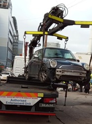 Abandoned vehicle being removed during operation in Grice Street and Bullock Street