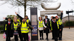 Children with wayfinder totem signage in Wednesbury town centre