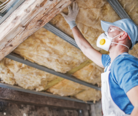 Man insulating loft as part of retrofit