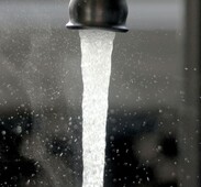 image of a running water tap