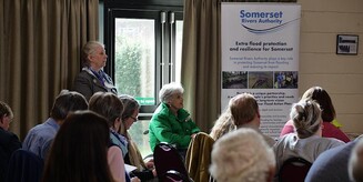 Somerset prepared resilience awards banner. image shows people attending a Somerset Rivers Authority seminar