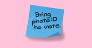 Post-it note captioned 'Bring photo ID to vote'