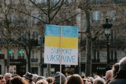 Large group of people holding a 'Support Ukraine' banner by Mathias Reding from pexels.com