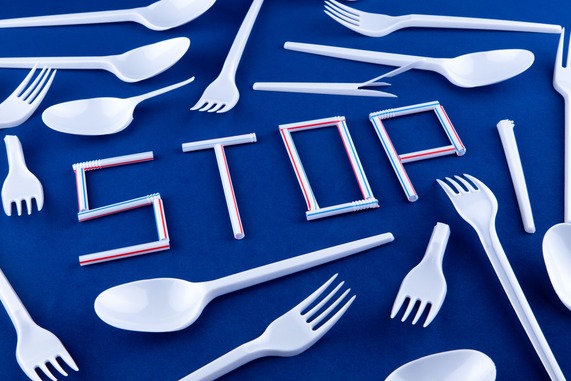 Plastic single use cutlery used to spell out the word stop