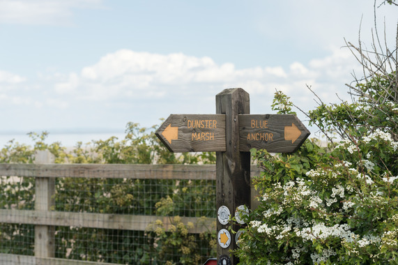 image of sign posting people towards dunster marshes and blue anchor